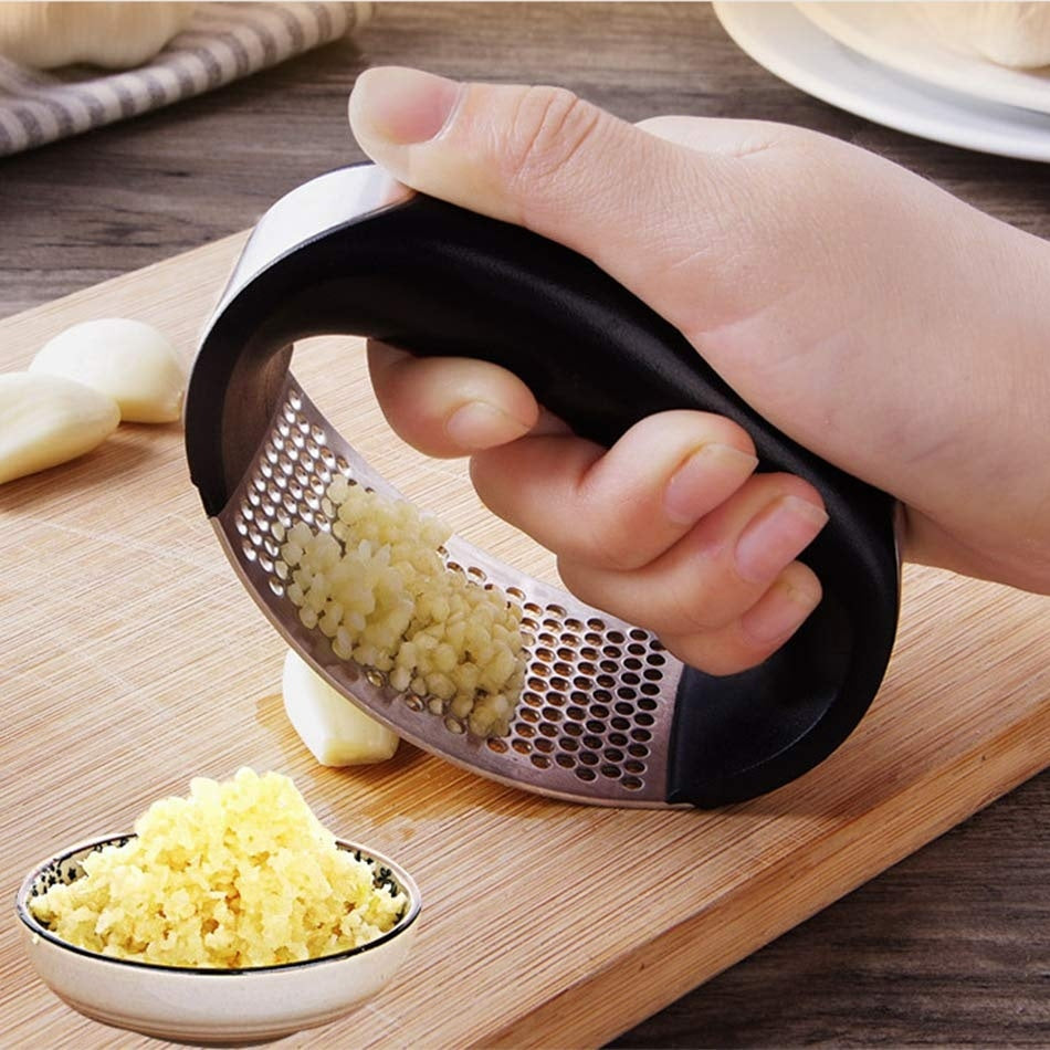 Crush garlic effortlessly with the sleek and ergonomic Stainless Steel Garlic Masher.