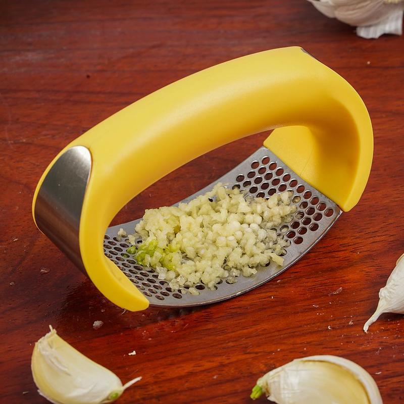 Crush garlic effortlessly with the sleek and ergonomic Stainless Steel Garlic Masher.