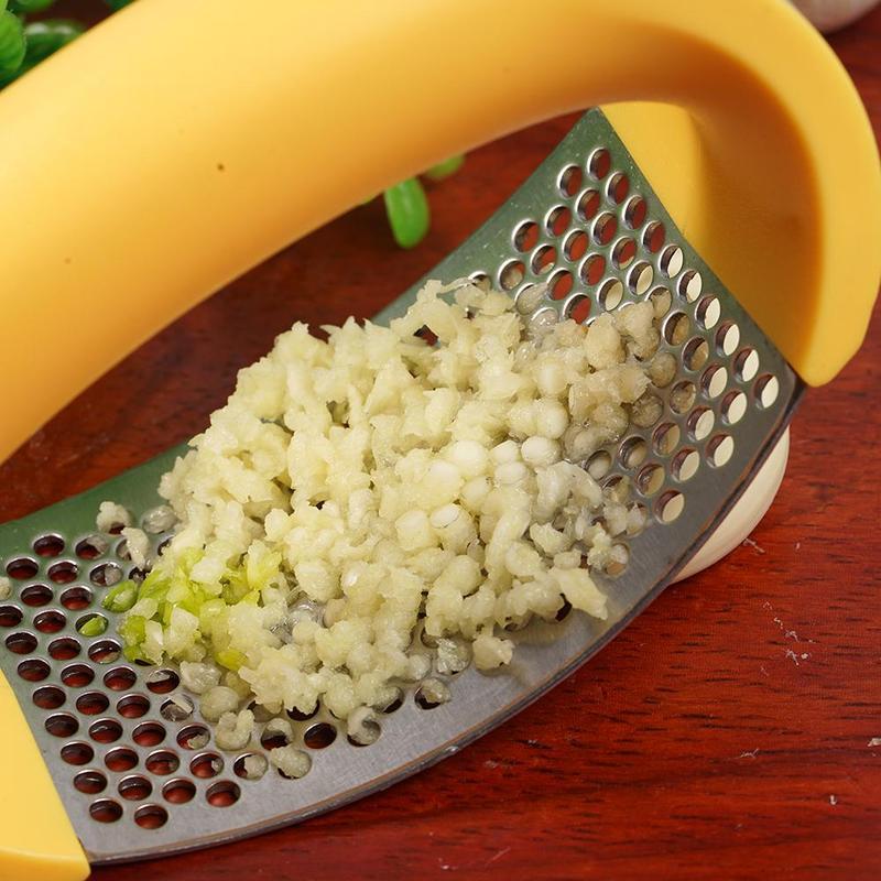 Crush garlic effortlessly with the sleek and ergonomic Stainless Steel Garlic Masher.