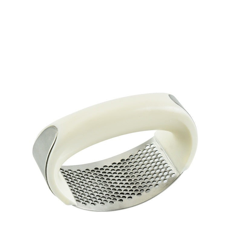 Crush garlic effortlessly with the sleek and ergonomic Stainless Steel Garlic Masher.