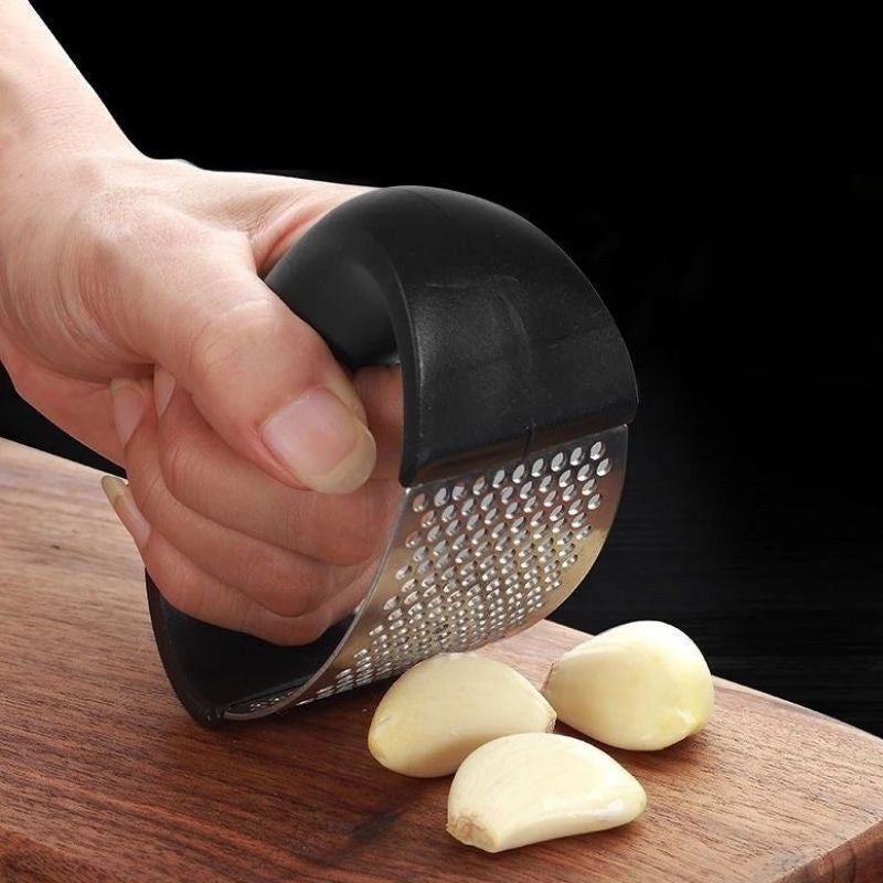 Crush garlic effortlessly with the sleek and ergonomic Stainless Steel Garlic Masher.