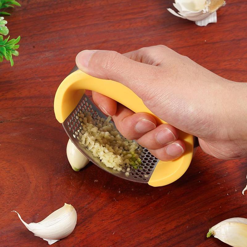 Crush garlic effortlessly with the sleek and ergonomic Stainless Steel Garlic Masher.